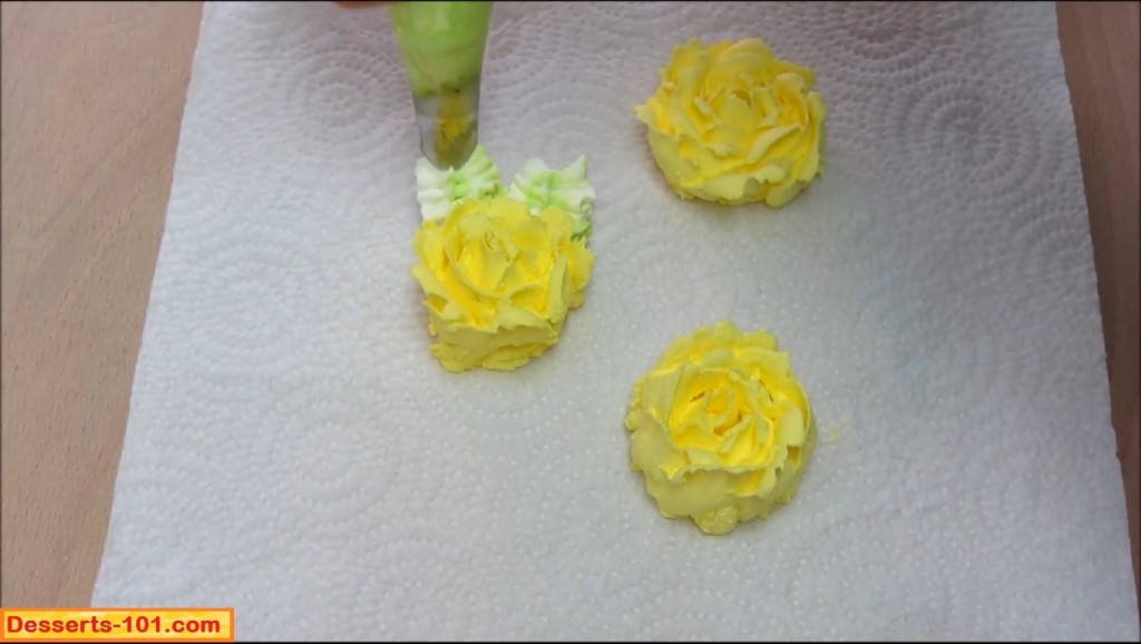 Adding leaves to buttercream roses