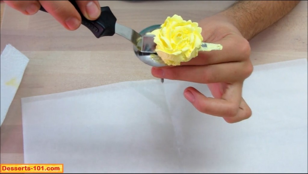 Lifting buttercream rose off of flower nail.