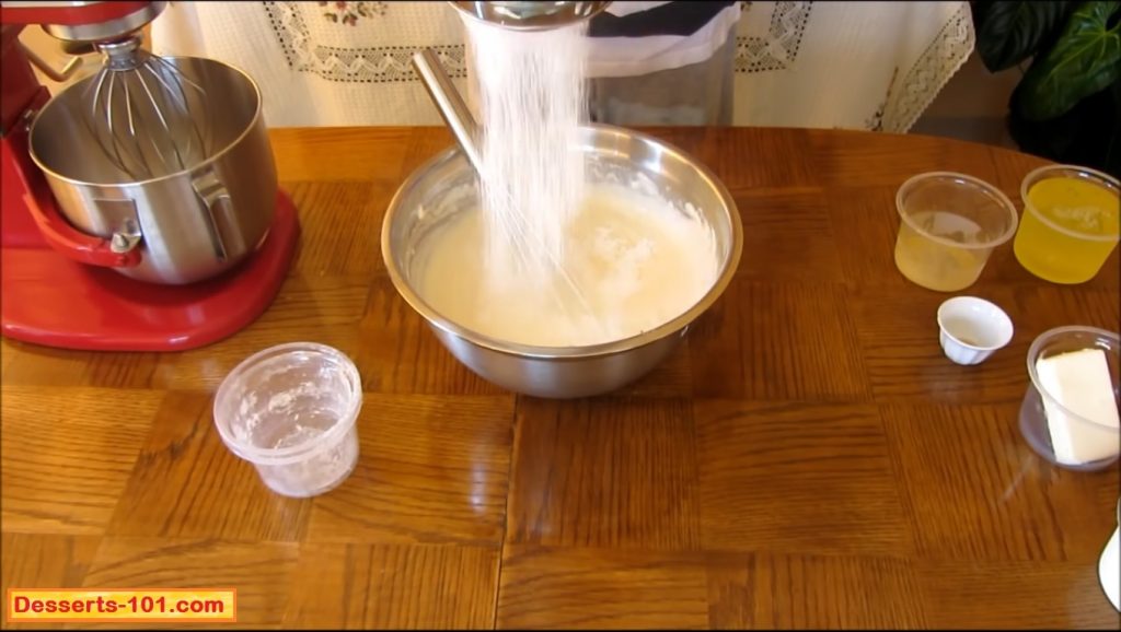 Sift the corn starch and flour into the cheese mixture.