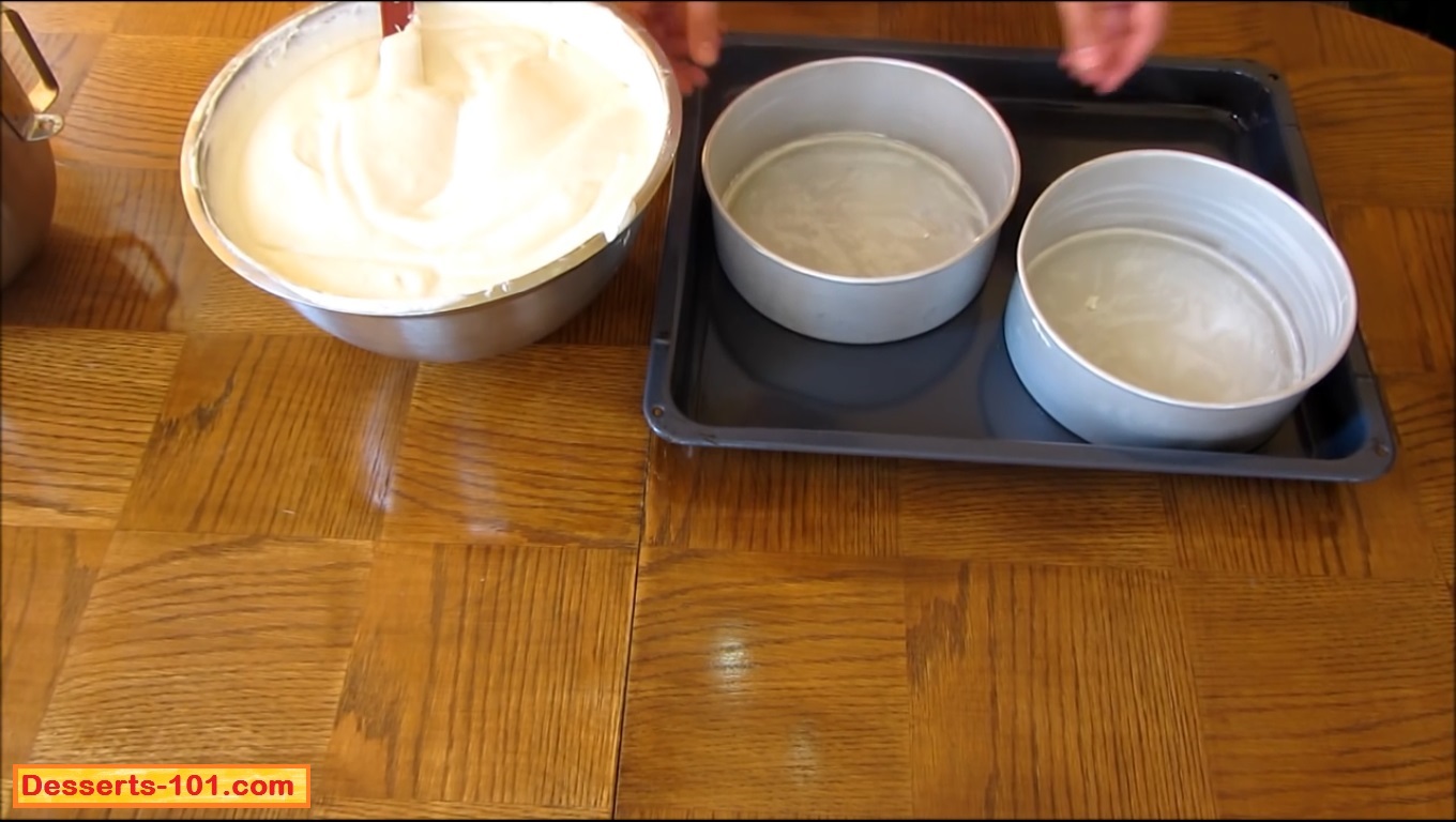 Pour the cheesecake batter into prepared baking pans.